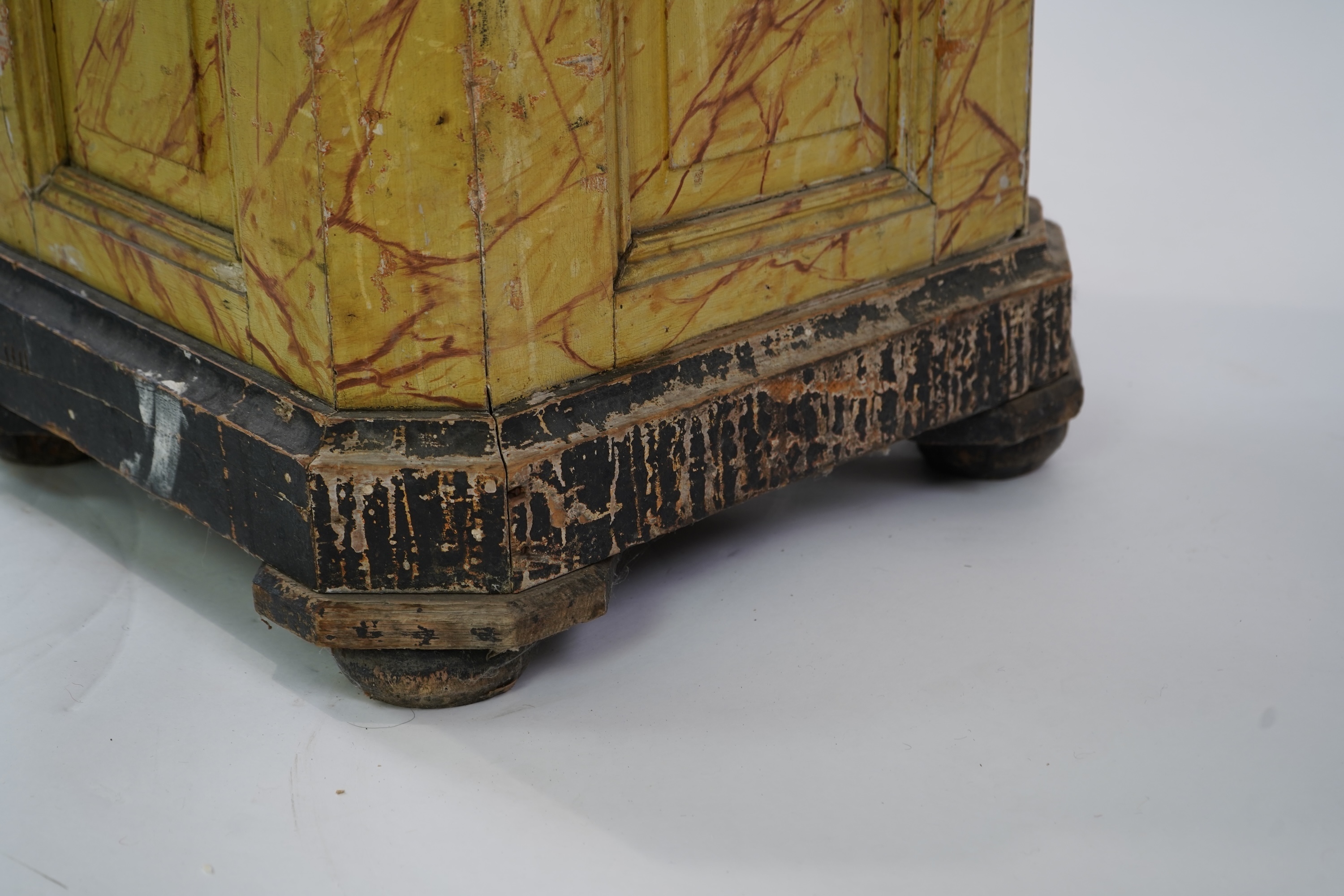 A Victorian white painted cast iron urn and a painted faux marble pedestal
